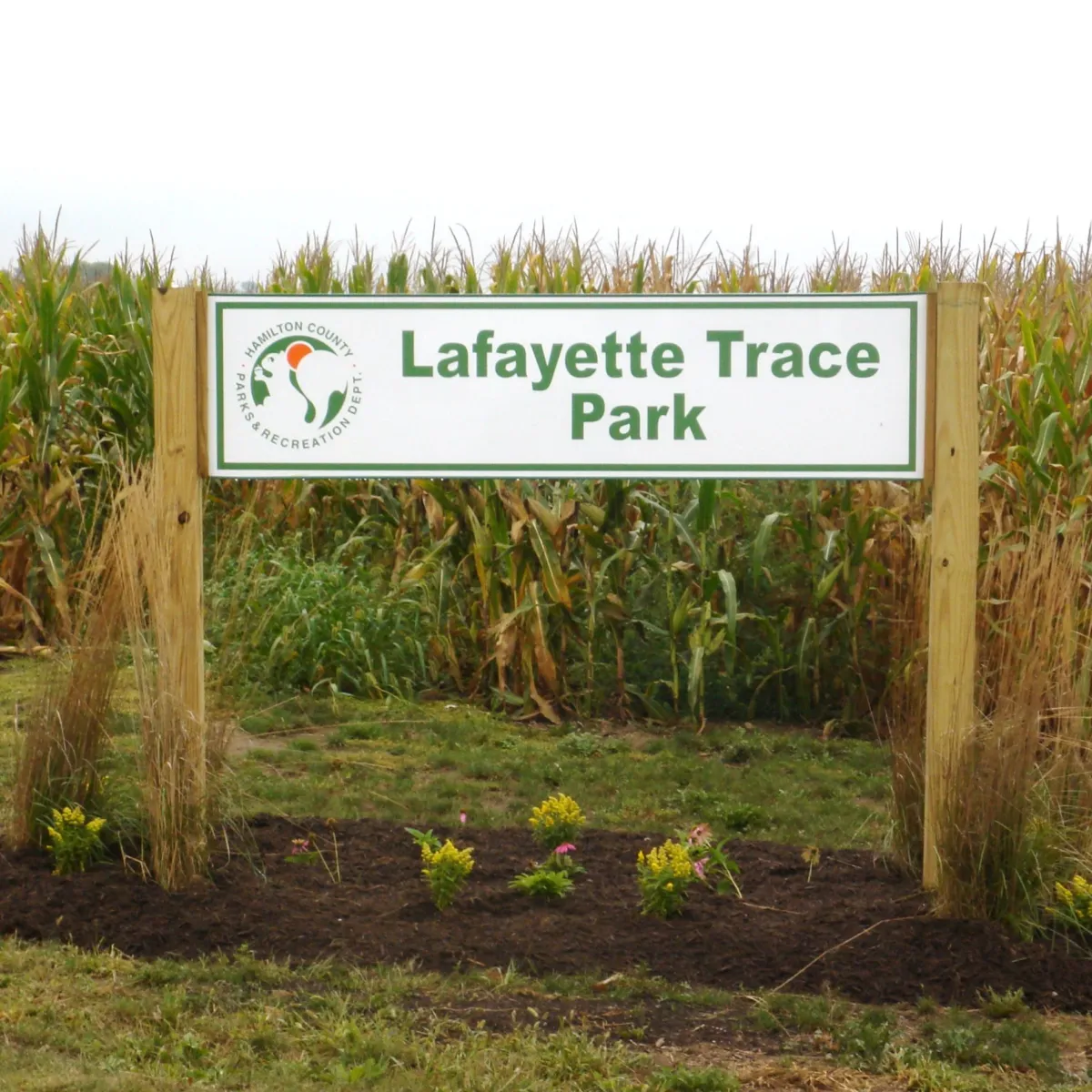 a sign sitting on the grass