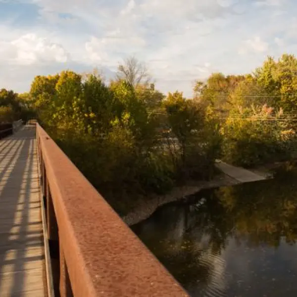 a train crossing a bridge over a body of water