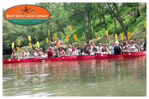 a group of people riding on the back of a boat